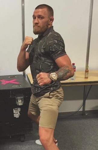 С чем носить темно-зеленую футболку-поло с камуфляжным принтом мужчине