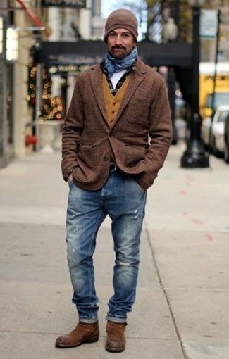 Как носить черную рубашку с длинным рукавом в клетку с коричневыми замшевыми ботинками челси в 30 лет мужчине: Если ты делаешь ставку на удобство и практичность, черная рубашка с длинным рукавом в клетку и синие рваные джинсы — прекрасный вариант для расслабленного повседневного мужского образа. Толику консерватизма и мужественности образу добавит пара коричневых замшевых ботинок челси.