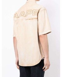 Мужская бежевая рубашка с коротким рукавом с принтом от AAPE BY A BATHING APE