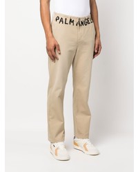 Бежевые брюки чинос с принтом от Palm Angels
