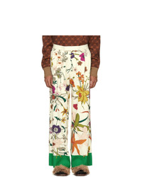 Бежевые брюки чинос с цветочным принтом от Gucci
