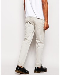 Бежевые брюки чинос от Love Moschino