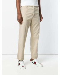 Бежевые брюки чинос от Gucci
