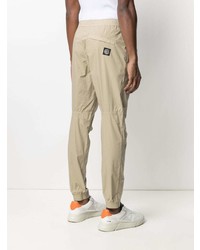Бежевые брюки чинос от Stone Island