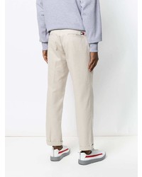 Бежевые брюки чинос от Tommy Jeans