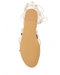 Бежевые кожаные сандалии на плоской подошве от Aldo