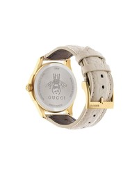 Женские бежевые часы от Gucci