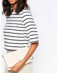 Бежевый клатч от Dune