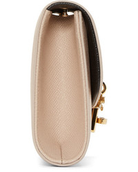 Бежевый кожаный клатч от Dolce & Gabbana