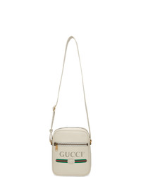 Белая кожаная сумка почтальона с принтом от Gucci