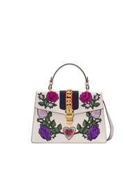 Белая кожаная сумка-саквояж с цветочным принтом от Gucci