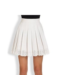 Белая короткая юбка-солнце с люверсами
