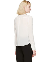 Белая шелковая блузка с рюшами от Nina Ricci