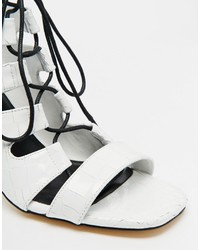 Бело-черные кожаные босоножки на каблуке от Senso