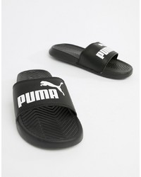 Бело-черные кожаные сандалии на плоской подошве от Puma