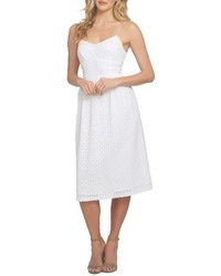 Белое платье-миди с люверсами