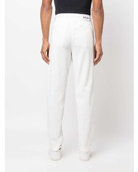 Белые брюки чинос от Kiton
