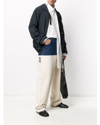 Мужские белые джинсы в стиле пэчворк от Raf Simons