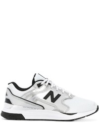 Женские белые кеды из плотной ткани от New Balance