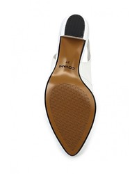 Белые кожаные босоножки на каблуке от Covani