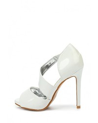 Белые кожаные босоножки на каблуке от Donna Moda