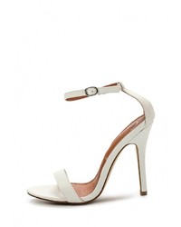 Белые кожаные босоножки на каблуке от Spurr