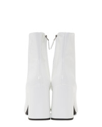 Белые кожаные ботильоны от Prada