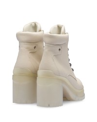 Белые кожаные массивные ботильоны на шнуровке от Prada