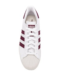 Мужские белые кожаные низкие кеды с принтом от adidas