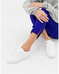 Женские белые кожаные низкие кеды от Nike
