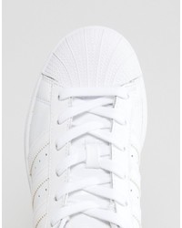 Женские белые кожаные низкие кеды от adidas