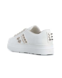 Женские белые кожаные низкие кеды от Prada