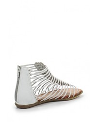 Белые кожаные сандалии на плоской подошве от Amazonga