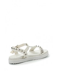 Белые кожаные сандалии на плоской подошве от Catisa