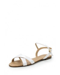 Белые кожаные сандалии на плоской подошве от Cecconello