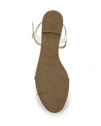 Белые кожаные сандалии на плоской подошве от Cecconello