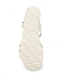 Белые кожаные сандалии на плоской подошве от Donna Moda