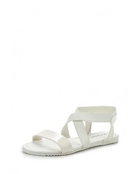 Белые кожаные сандалии на плоской подошве от Donna Moda