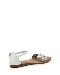 Белые кожаные сандалии на плоской подошве от Gioseppo