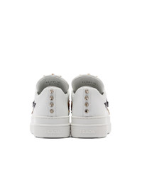 Женские белые кроссовки с шипами от Prada