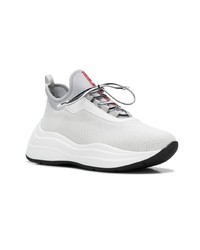 Женские белые кроссовки от Prada