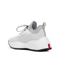 Женские белые кроссовки от Prada