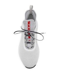 Женские белые кроссовки от Prada