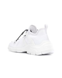 Женские белые кроссовки от Prada