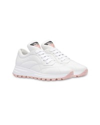 Женские белые кроссовки от Prada