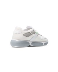 Женские белые кроссовки от Prada