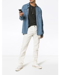 Мужские белые рваные зауженные джинсы от Saint Laurent