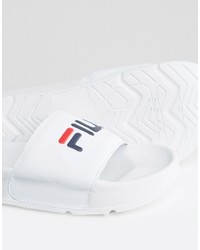 Белые сандалии на плоской подошве от Fila