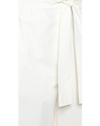 Белые шелковые широкие брюки от Acne Studios