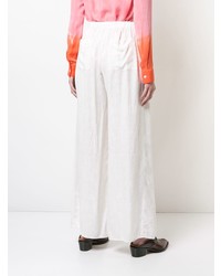 Белые широкие брюки от Raquel Allegra